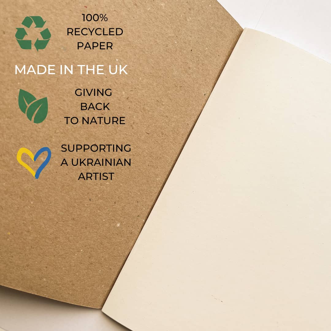 Recycled paper notebook inside detail with environmental and humanitarian claims
