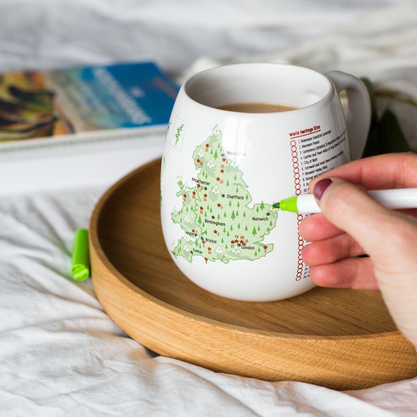 Colouring UK national parks on Explorer mug with ceramic pen, personalising visited places, travel keepsake mug
