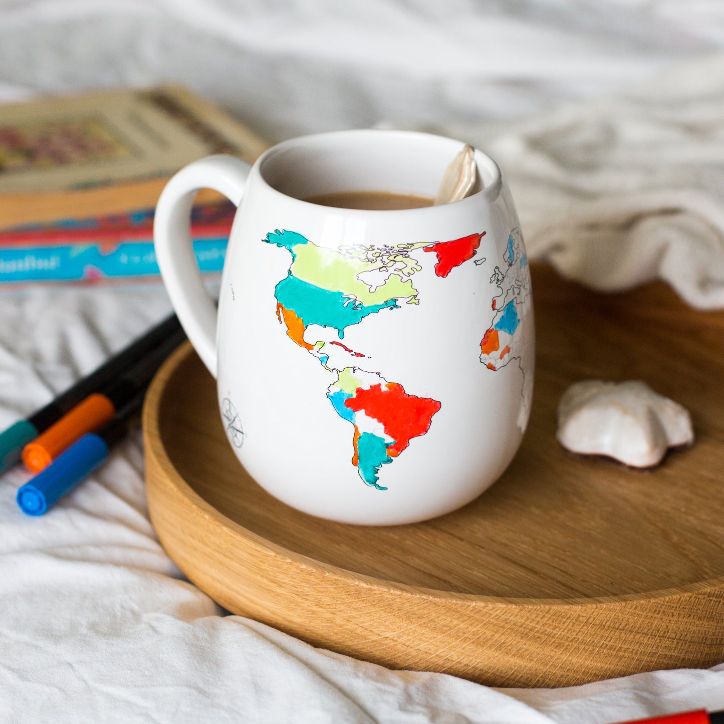 Countries visited coloured in on a world map mug on a wooden tray, thoughtful gift for travellers