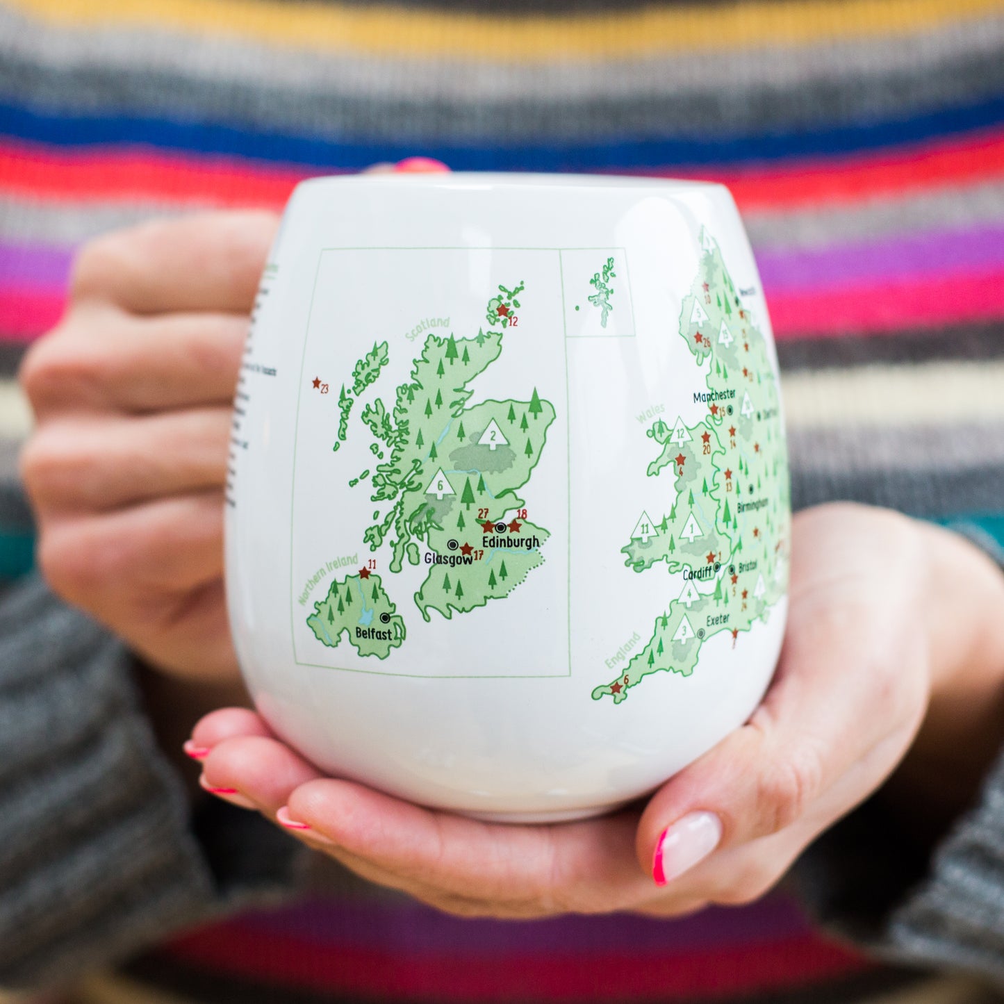 Hands holding UK Explorer colour-in mug showing national parks and heritage sites, personalised travel memories mug