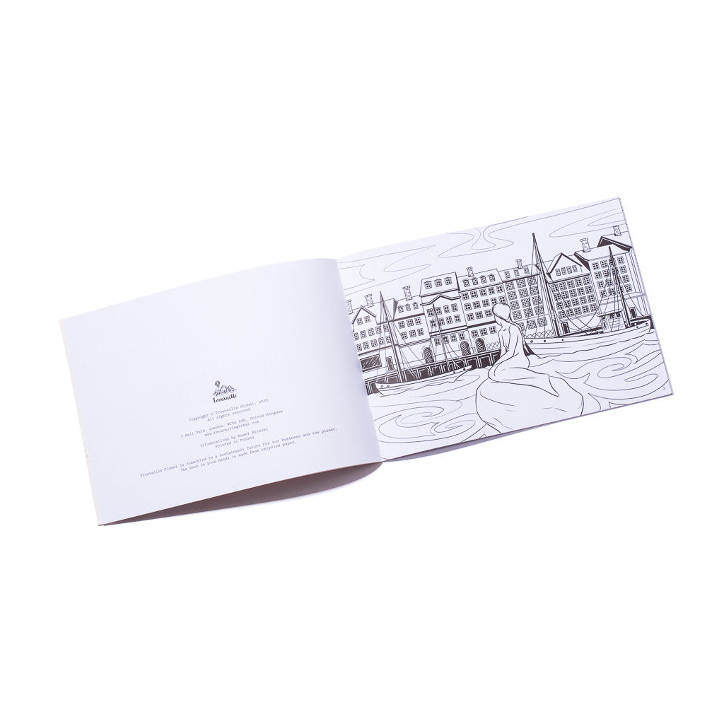 Open pages of world travel colouring book on recycled paper showing Copenhagen (Denmark), mindful colouring activity inspired by global landmarks.