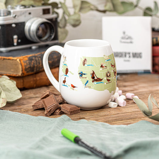 White ceramic Birder’s Checklist mug with U.S. map featuring bird illustrations and green ceramic marker, interactive gift for birdwatchers