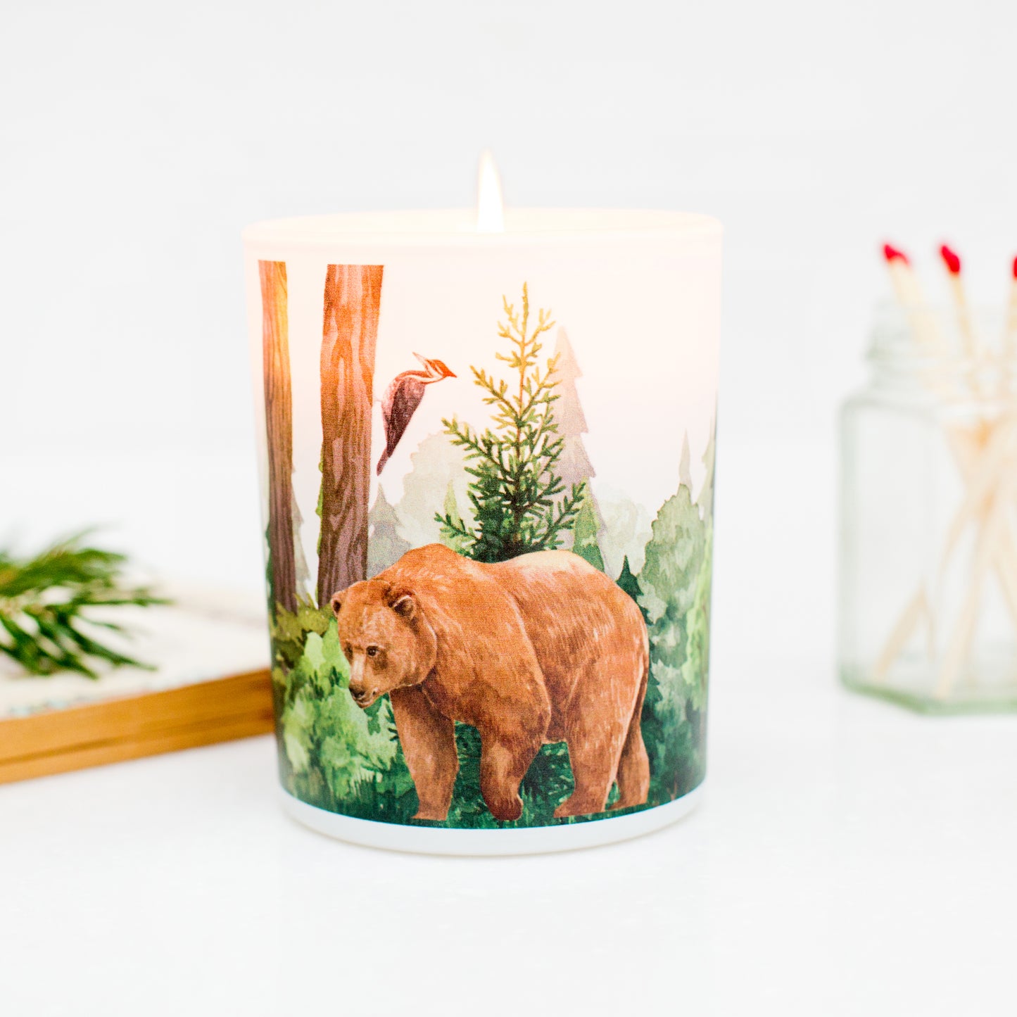 Woodland bear illustrated forest soy candle inspired by wild landscapes, eco-friendly gift for nature lovers.