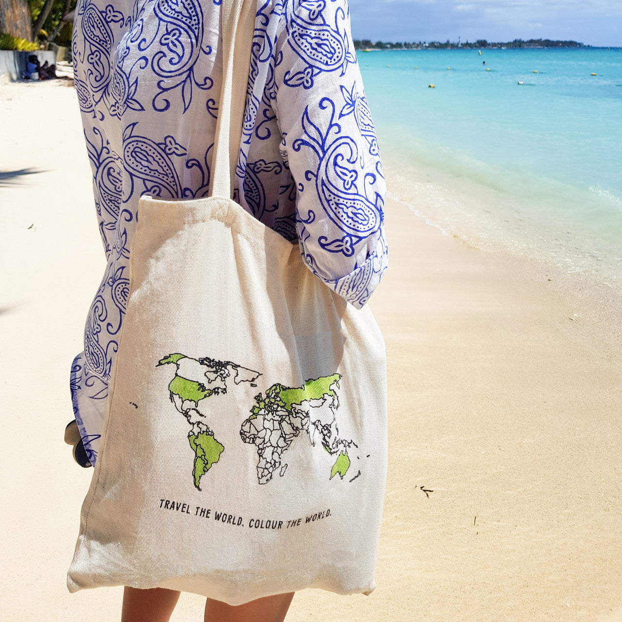 World map colour-in tote bag worn at the beach, eco-friendly travel tote for marking countries explored, travel memory gift